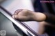 A close up of a person's foot on an escalator.