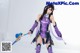 A woman in a purple outfit holding a sword.