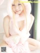 A woman in a pink bunny costume posing for a picture.