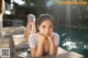 A woman laying on the edge of a swimming pool.