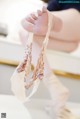 A close up of a baby's feet in a pair of ballet shoes.