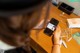 A woman sitting at a table with a cell phone in her hand.